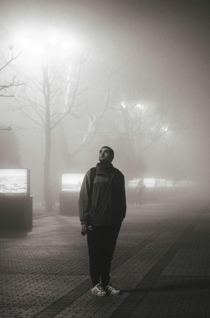 A persion standing for bus and listen inner voice